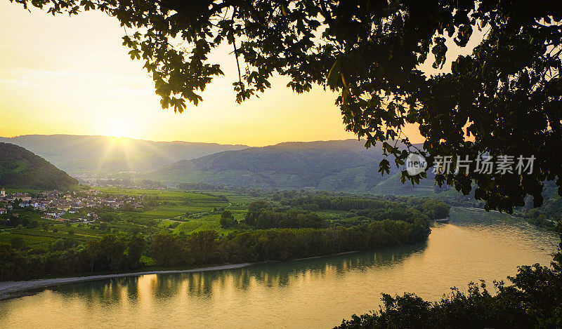 Visit to the Wachau. A beautiful sunset over the vineyards and the Danube river. View from Dürnstein upstream towards the small market town of Rossatz.